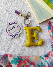 Load image into Gallery viewer, Key ring bag charm. Cute bag charm with stuffed alphabet. Hand bag charms. Felt bag charm. Unusual bag charm. Pink bag charm. Bag charm with lobster claw clip. Luxury bag charm. Tessel bag charm.