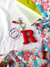 Load image into Gallery viewer, Key ring bag charm. Cute bag charm with stuffed alphabet. Hand bag charms. Felt bag charm. Unusual bag charm. Pink bag charm. Bag charm with lobster claw clip. Luxury bag charm. Tessel bag charm.