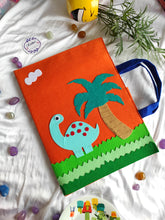 Load image into Gallery viewer, Craft bag. Craft tote. Kraft gift bags. Felt handbag. Felt tote bag. Felt pouch. Felt gift bag. Craft folder. Felt craft folder. Personalized gift. Kids gift. Kids personalized gift. Unique gift. Handmade personalized gift. Handmade gift. orange folder. dinosaur folder. Gift for boy
