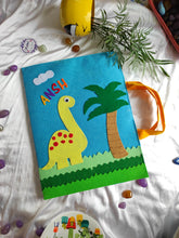Load image into Gallery viewer, Craft bag. Craft tote. Kraft gift bags. Felt handbag. Felt tote bag. Felt pouch. Felt gift bag. Craft folder. Felt craft folder. Personalized gift. Kids gift. Kids personalized gift. Unique gift. Handmade personalized gift. Handmade gift. blue folder. dinosaur folder. Gift for boy