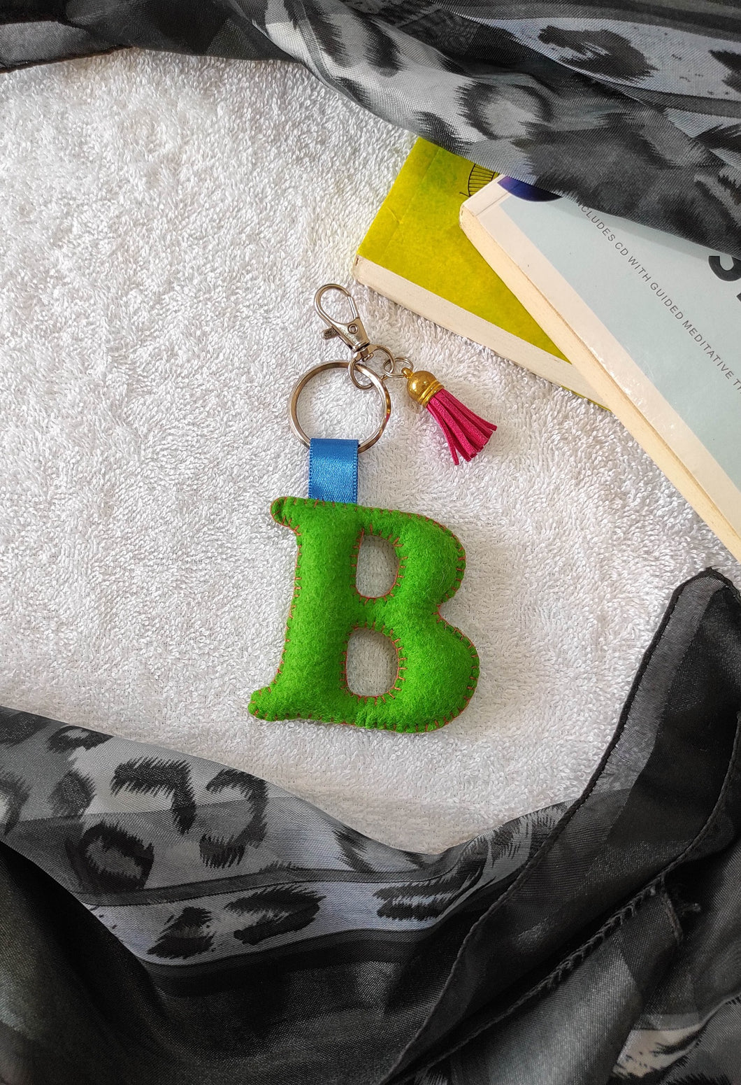 Key ring bag charm. Cute bag charm with stuffed alphabet. Hand bag charms. Felt bag charm. Unusual bag charm. Pink bag charm. Bag charm with lobster claw clip. Luxury bag charm. Tessel bag charm.