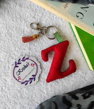 Load image into Gallery viewer, Key ring bag charm. Cute bag charm with stuffed alphabet. Hand bag charms. Felt bag charm. Unusual bag charm. Pink bag charm. Bag charm with lobster claw clip. Luxury bag charm. Tessel bag charm.
