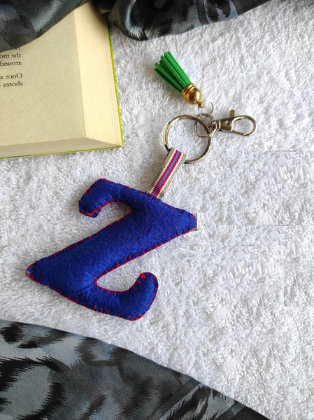 Key ring bag charm. Cute bag charm with stuffed alphabet. Hand bag charms. Felt bag charm. Unusual bag charm. Pink bag charm. Bag charm with lobster claw clip. Luxury bag charm. Tessel bag charm.