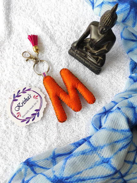 Key ring bag charm. Cute bag charm with stuffed alphabet. Hand bag charms. Felt bag charm. Unusual bag charm. Pink bag charm. Bag charm with lobster claw clip. Luxury bag charm. Tessel bag charm.