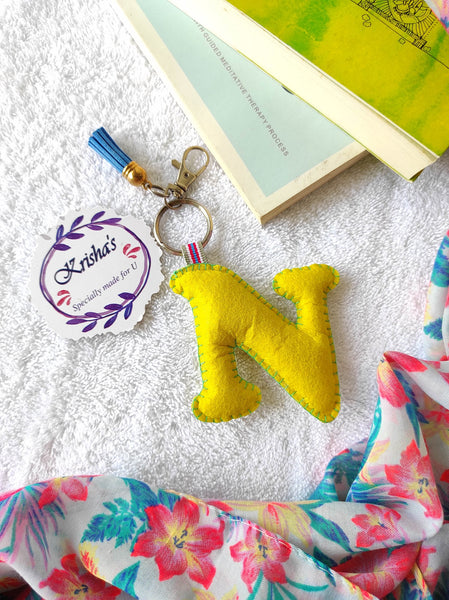 Key ring bag charm. Cute bag charm with stuffed alphabet. Hand bag charms. Felt bag charm. Unusual bag charm. Pink bag charm. Bag charm with lobster claw clip. Luxury bag charm. Tessel bag charm.