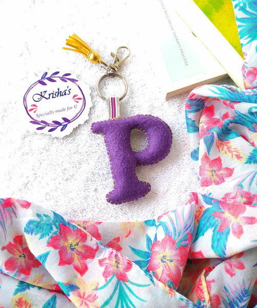 Key ring bag charm. Cute bag charm with stuffed alphabet. Hand bag charms. Felt bag charm. Unusual bag charm. Pink bag charm. Bag charm with lobster claw clip. Luxury bag charm. Tessel bag charm.