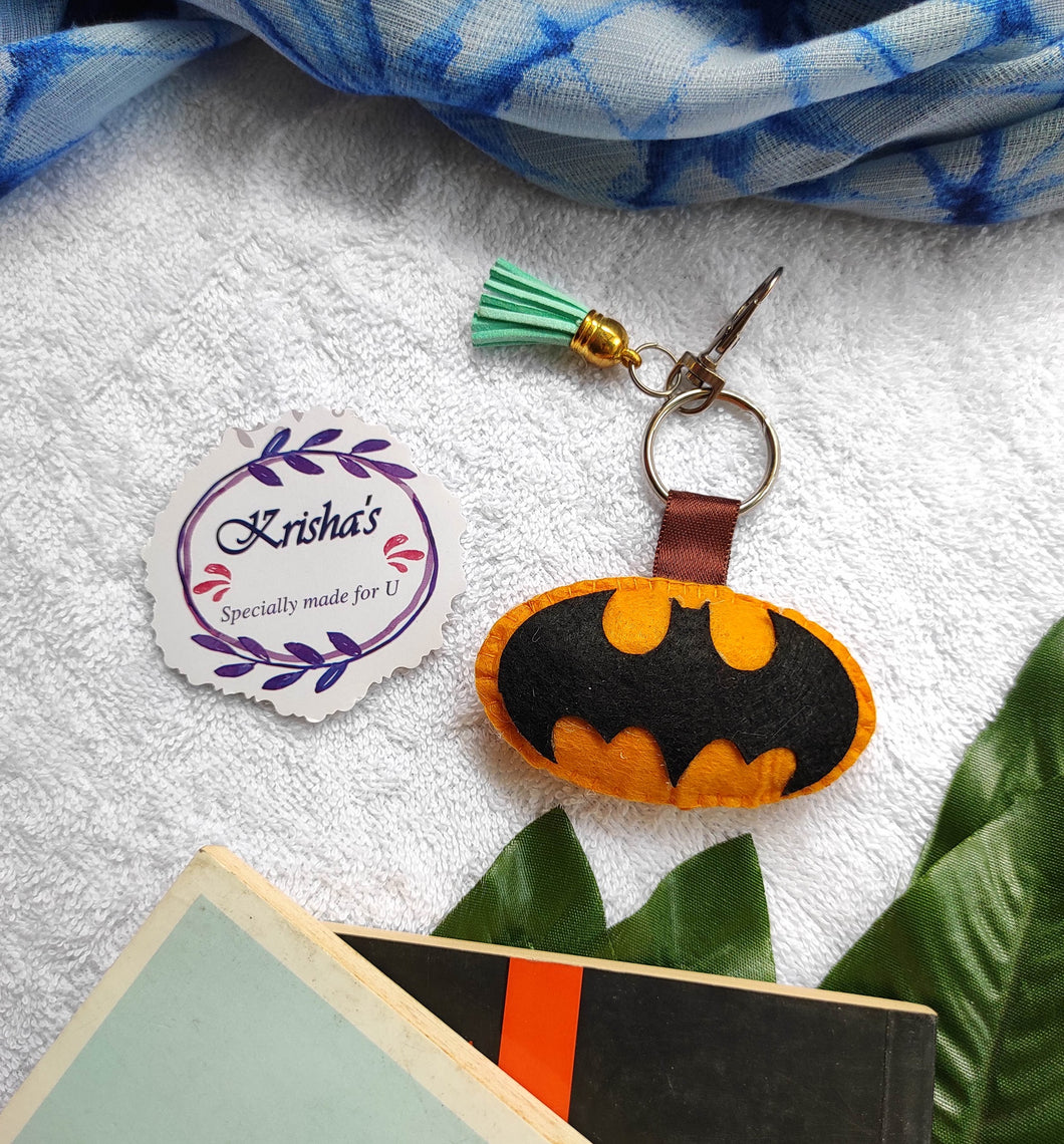 Batman bag charm. Stuffed felt bag charm. Superhero bag charm. Key ring bag charm. Cute bag charm. Hand bag charms. Felt bag charm. Unusual bag charm. Bag charm with lobster claw clip. Luxury bag charm. Tessel bag charm.